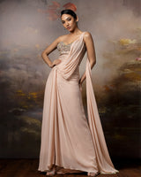 Featuring a beige corset saree gown in gorgette, crepe and net with embroidery on the corset and danglings at the pallu.