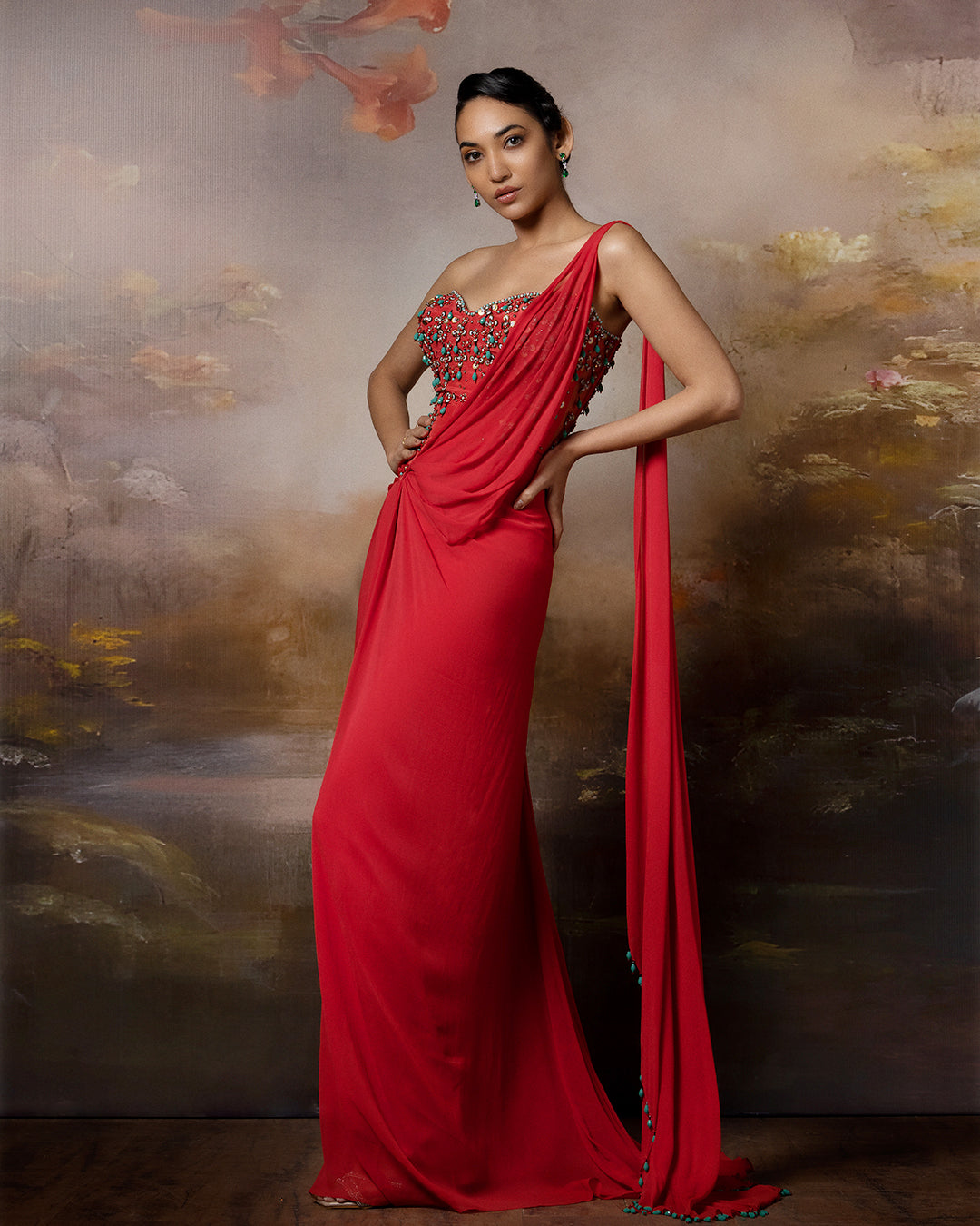Featuring a corset saree gown with embroidered corset and danglings on the pallu