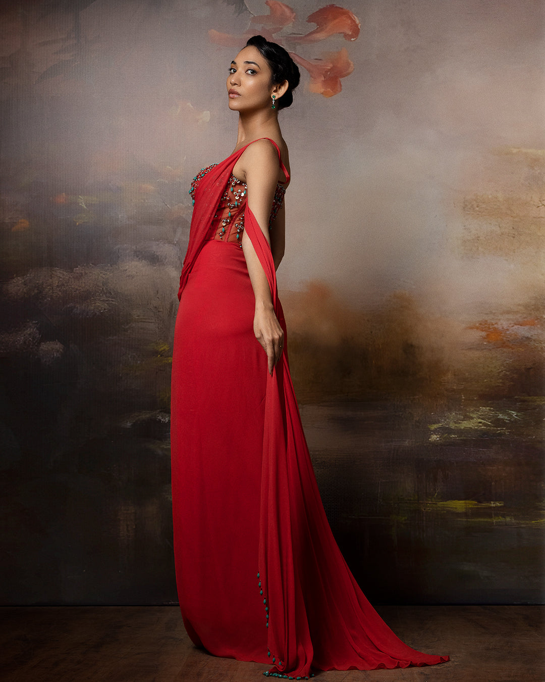 Featuring a corset saree gown with embroidered corset and danglings on the pallu