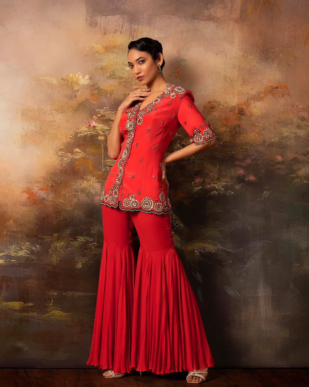 Featuring an embroidered long jacket and sharara pants in gorgette and crepe