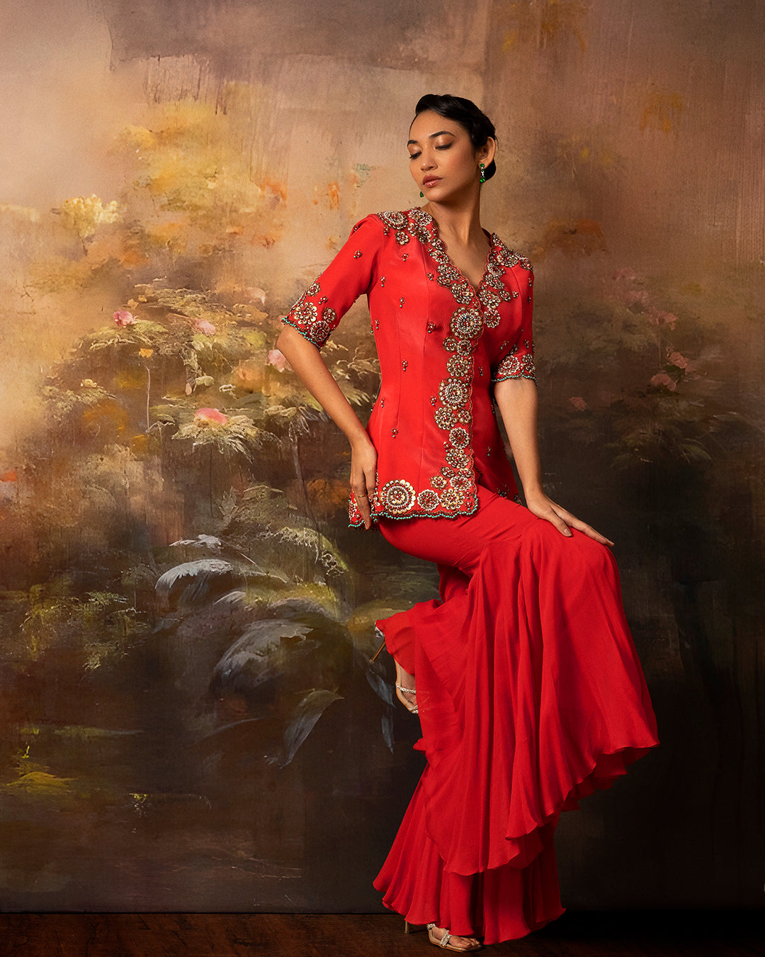 Featuring an embroidered long jacket and sharara pants in gorgette and crepe