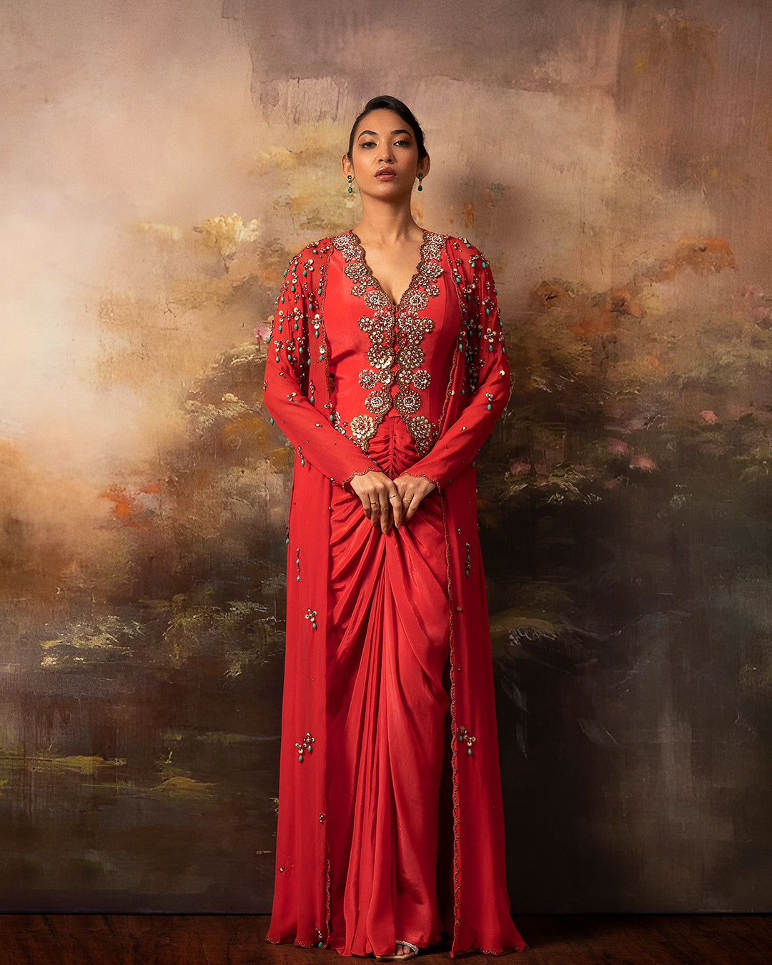Featuring an embroidered jacket waistcoat and front gathered skirt in crepe and gorgette