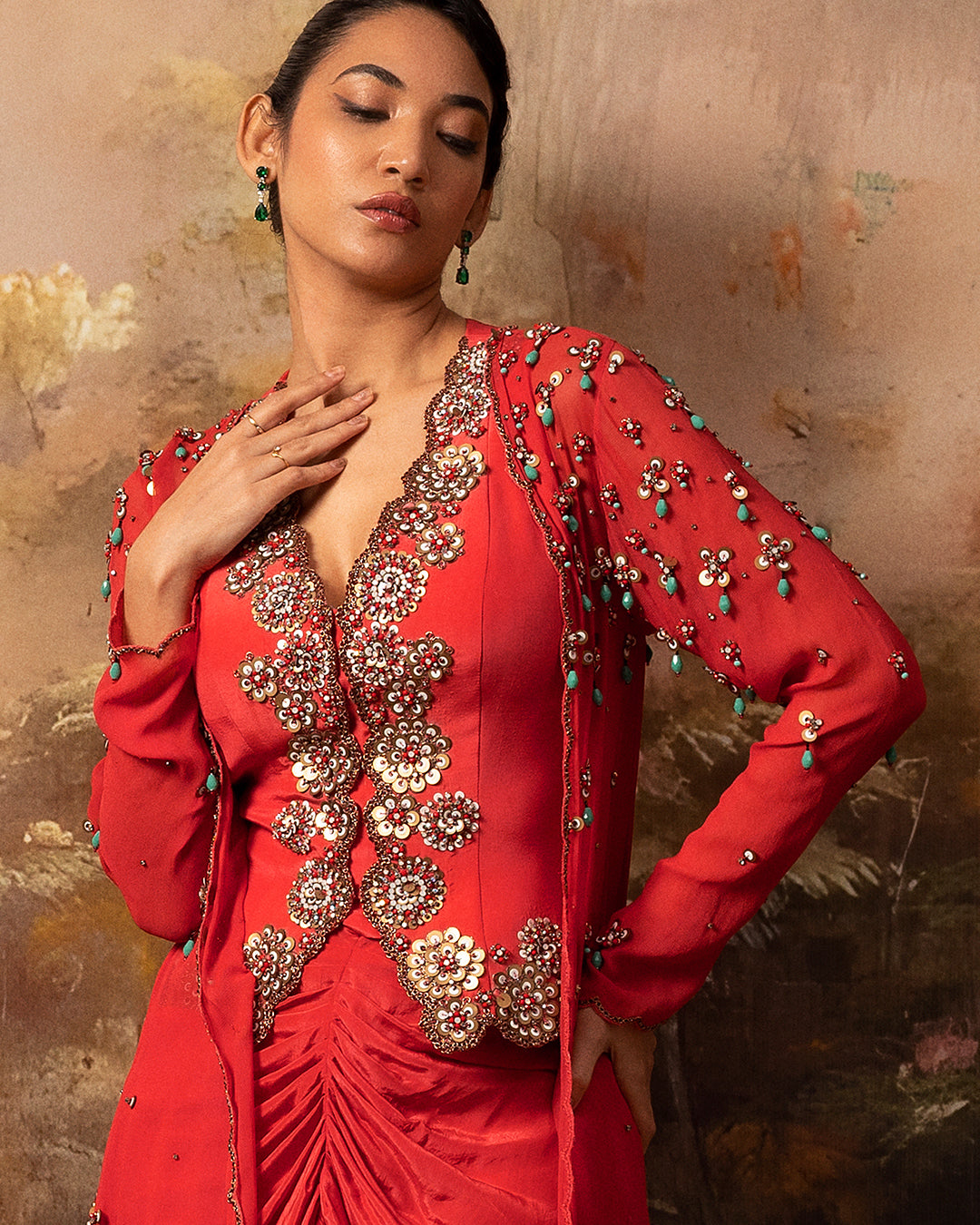 Featuring an embroidered jacket waistcoat and front gathered skirt in crepe and gorgette