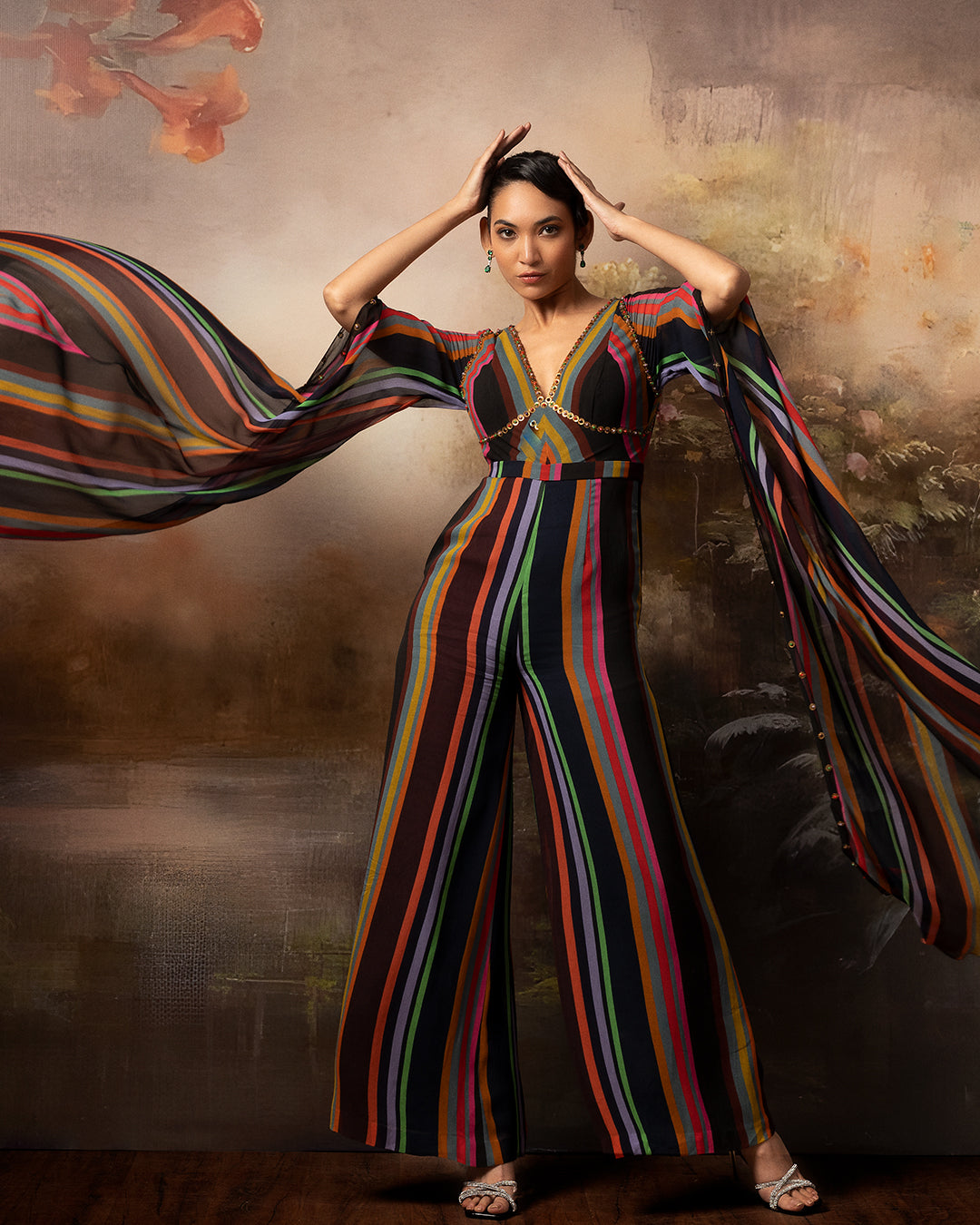 Featuring a chevron embroidered jumpsuit in gorgette