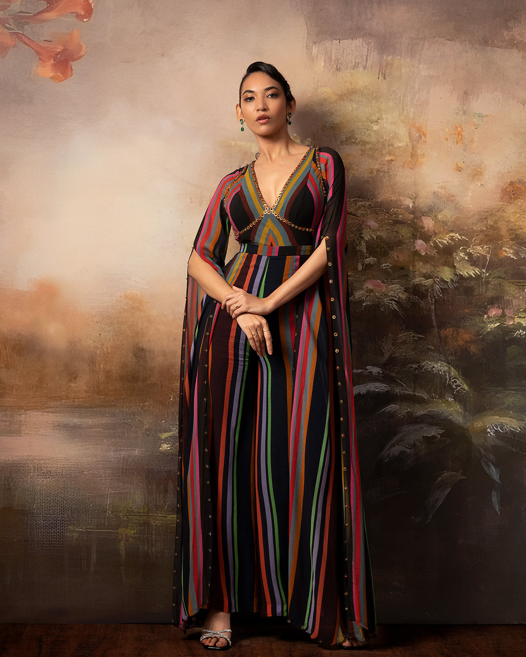 Featuring a chevron embroidered jumpsuit in gorgette