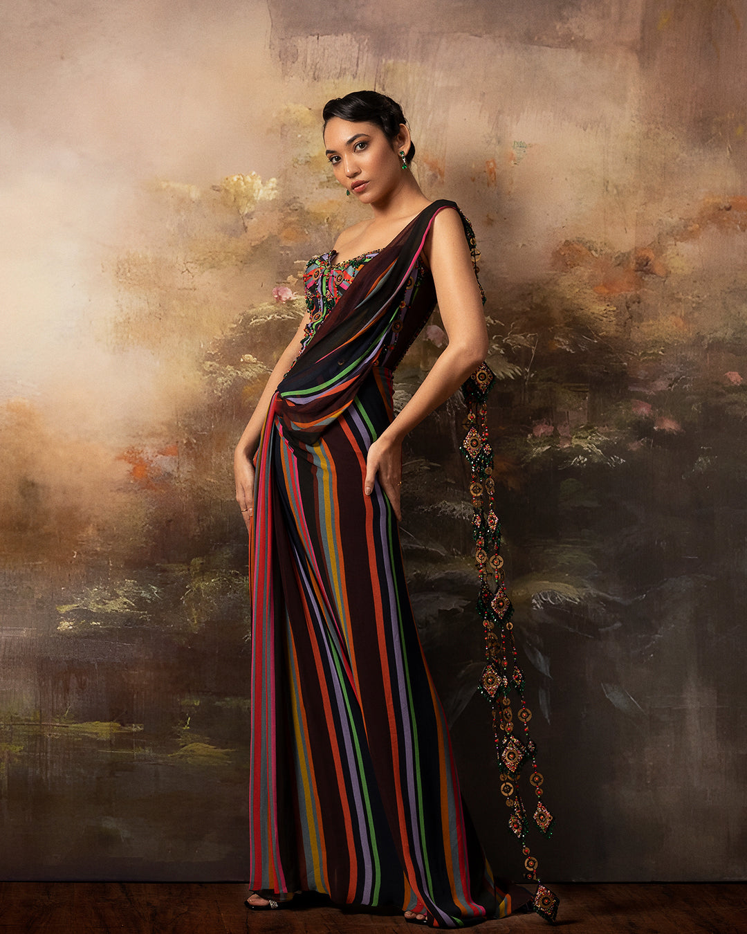 Featuring a corset saree gown in gorgette crepe and net with mesh embroidery in the corset