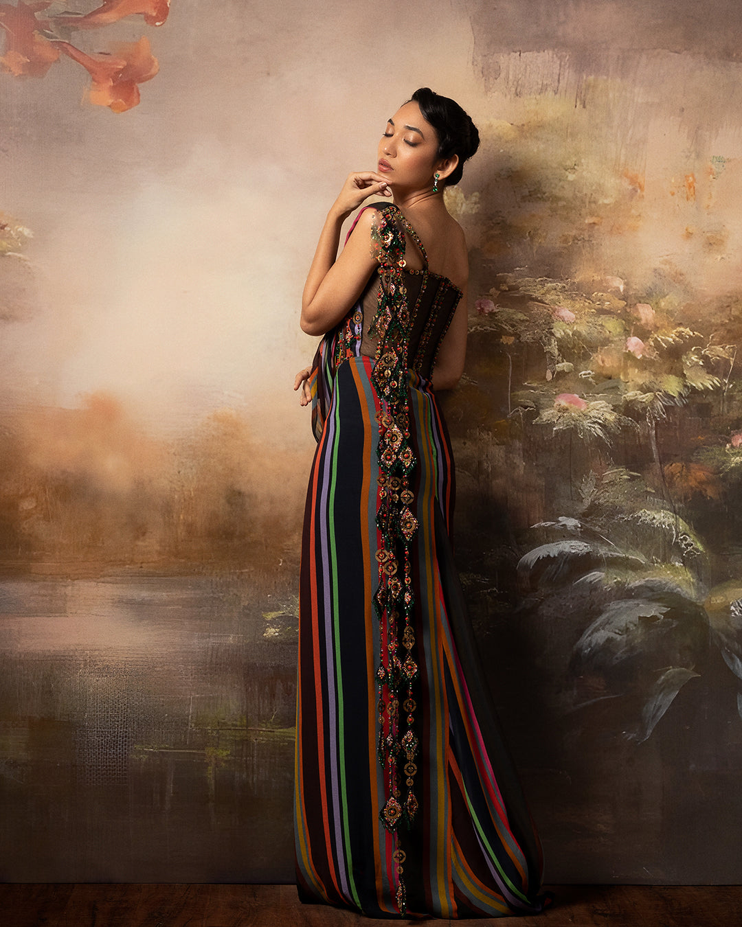 Featuring a corset saree gown in gorgette crepe and net with mesh embroidery in the corset
