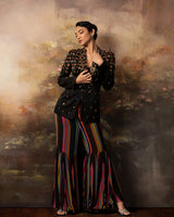 Featuring an embroidered long jacket and sharara pants in gorgette and linen satin