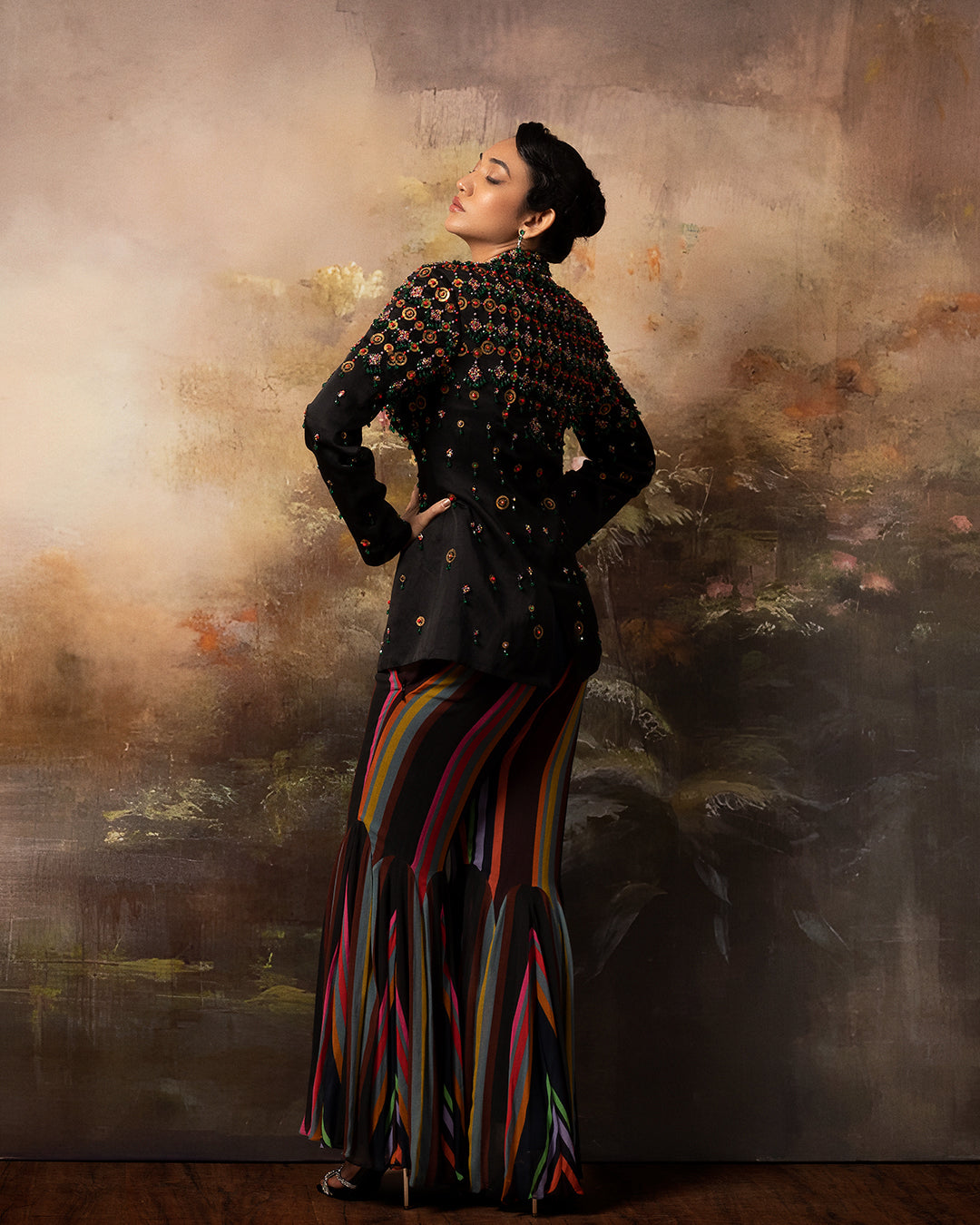 Featuring an embroidered long jacket and sharara pants in gorgette and linen satin