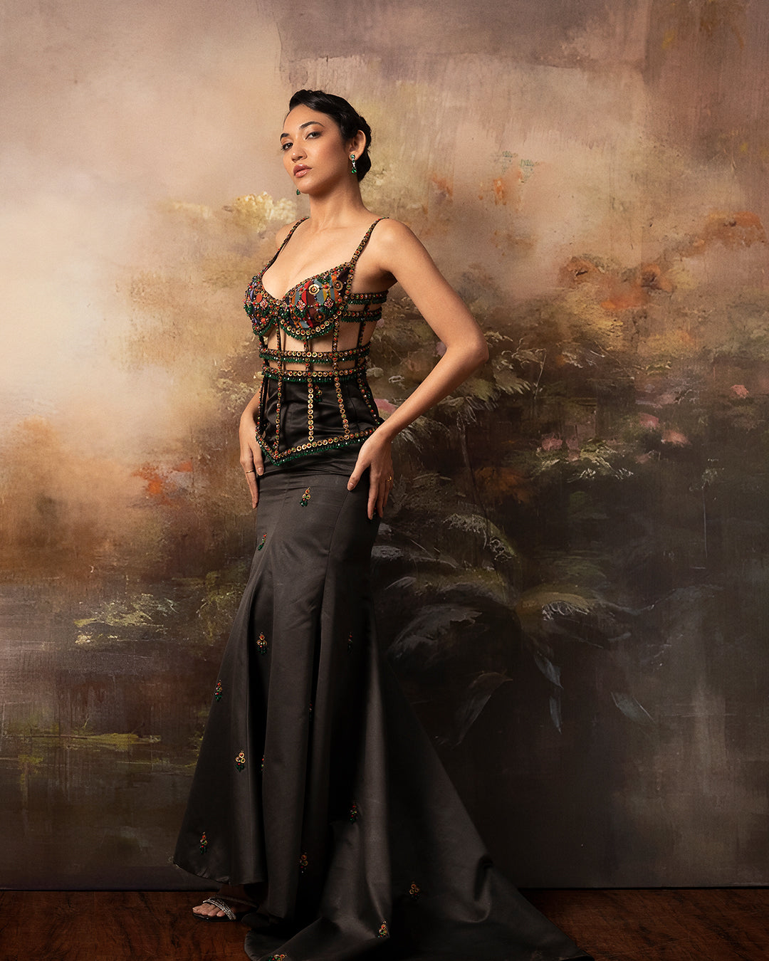 Featuring a embroidered cage corset with long fishtail skirt