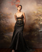 Featuring a embroidered cage corset with long fishtail skirt