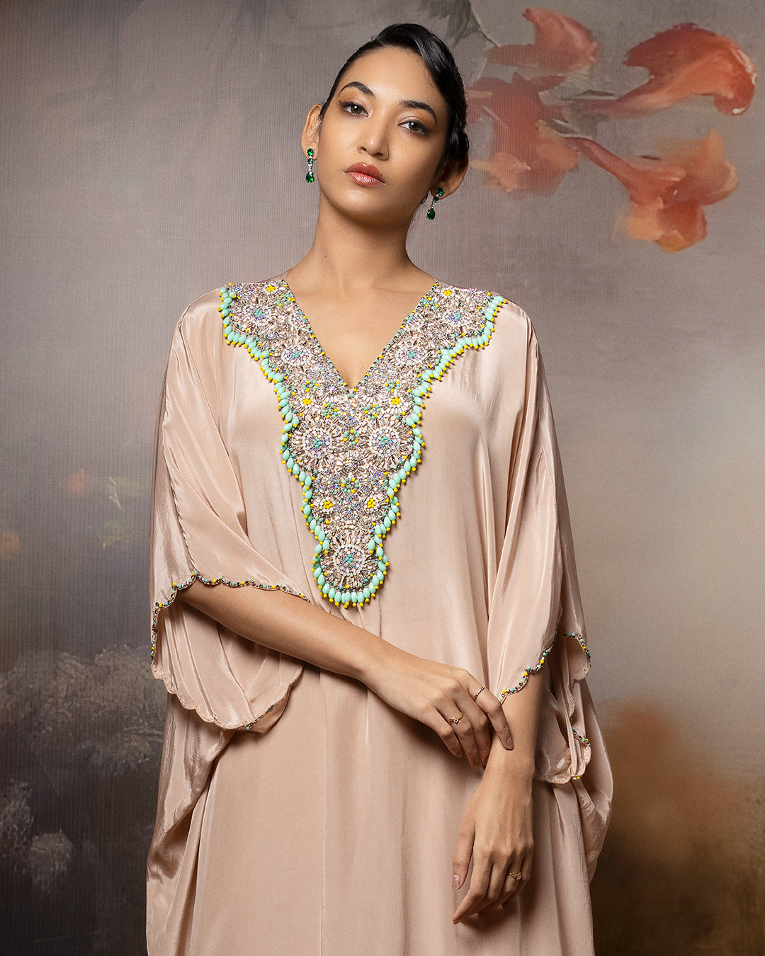 Featuring an embroidered kaftan set in crape with embroidery patch on the neck