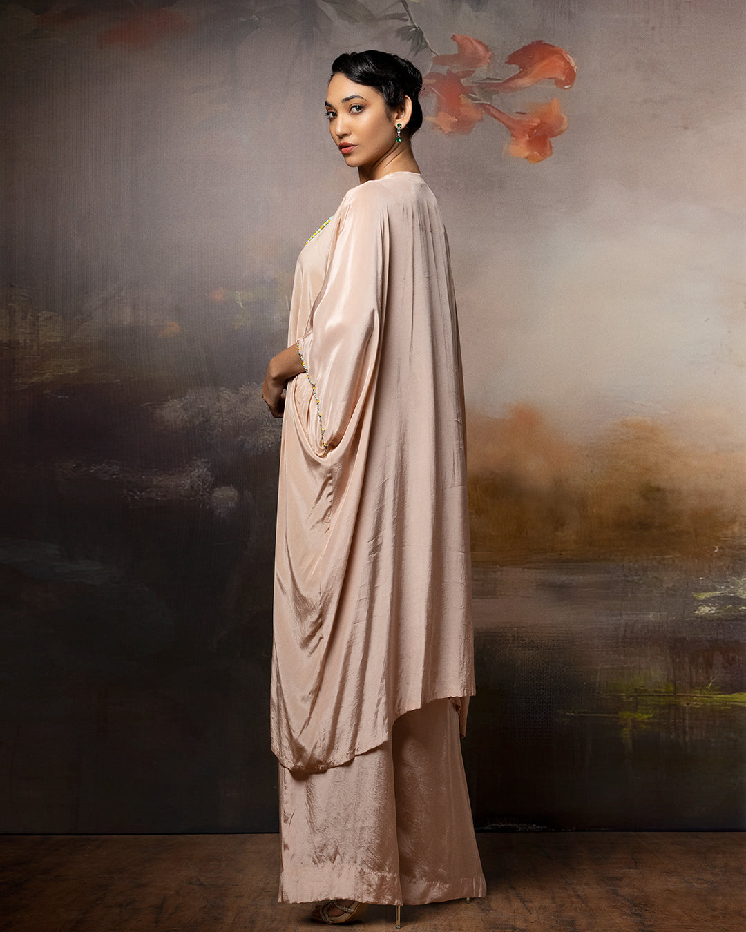 Featuring an embroidered kaftan set in crape with embroidery patch on the neck