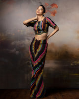 Featuring a scalloped top with front gathered skirt in crepe