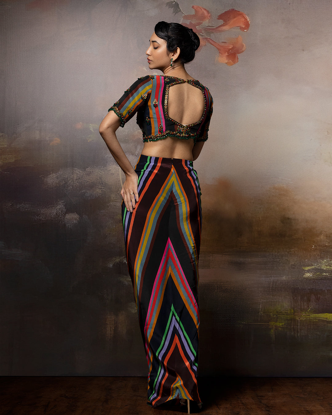 Featuring a scalloped top with front gathered skirt in crepe