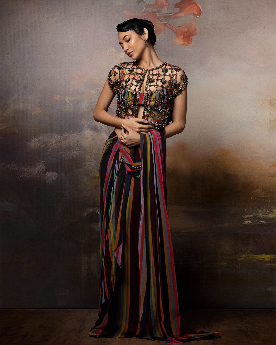 Featuring a attached saree with mesh jacket in gorgette and crepe