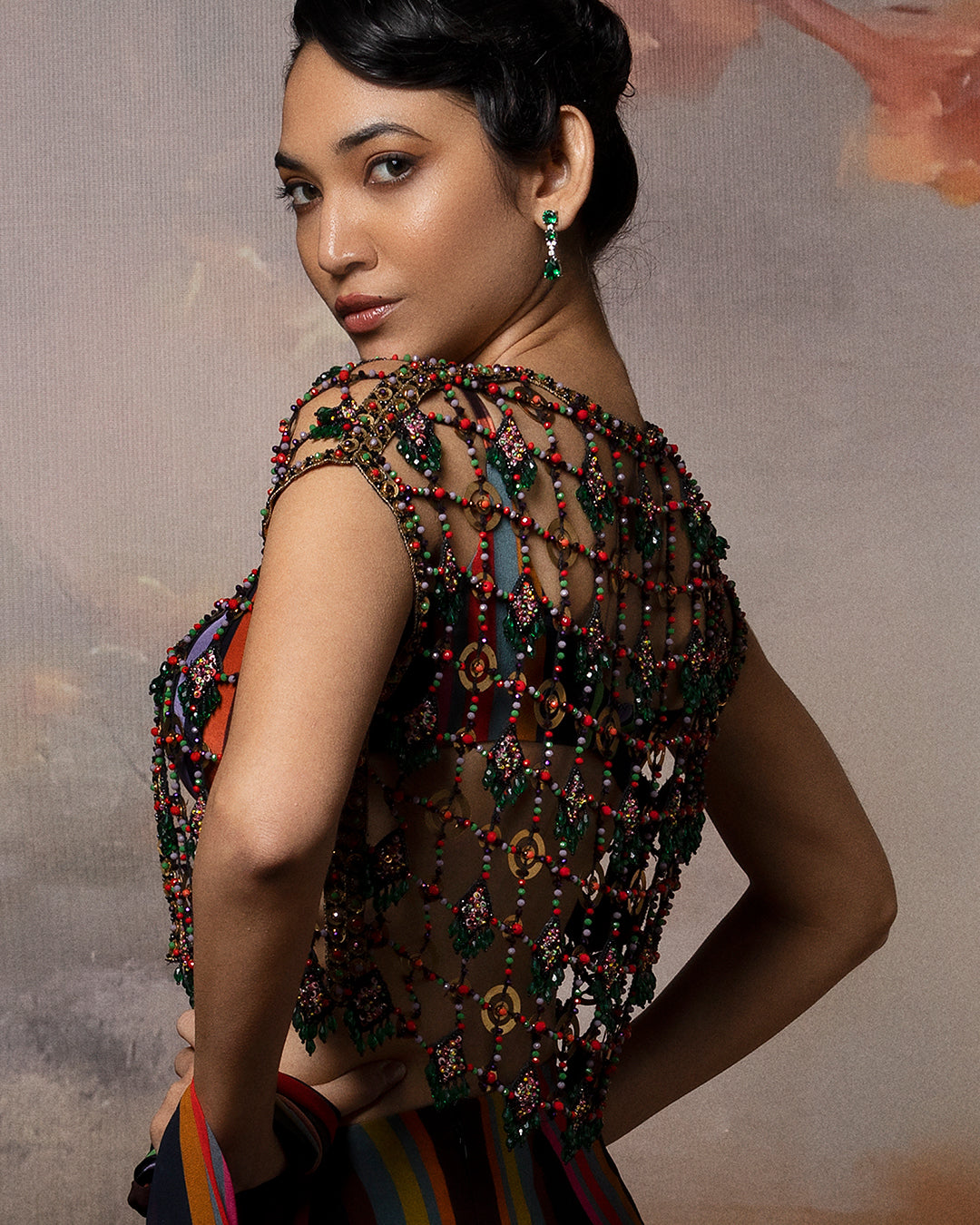 Featuring a attached saree with mesh jacket in gorgette and crepe