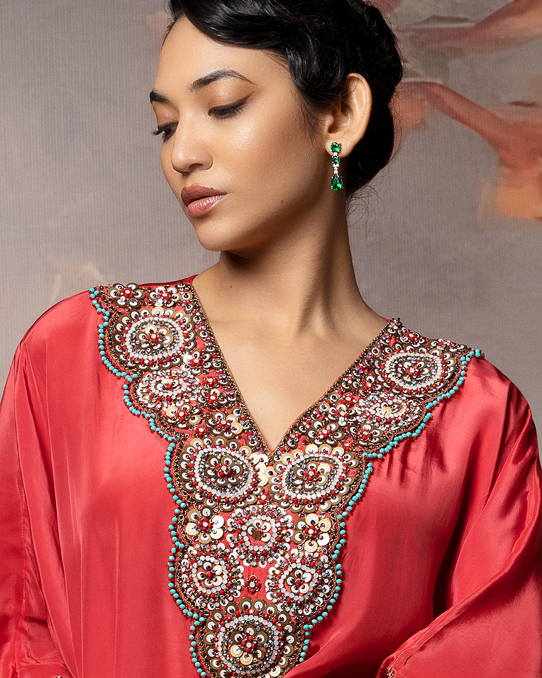 Featuring a kaftan kurti in crepe with embroidered neck