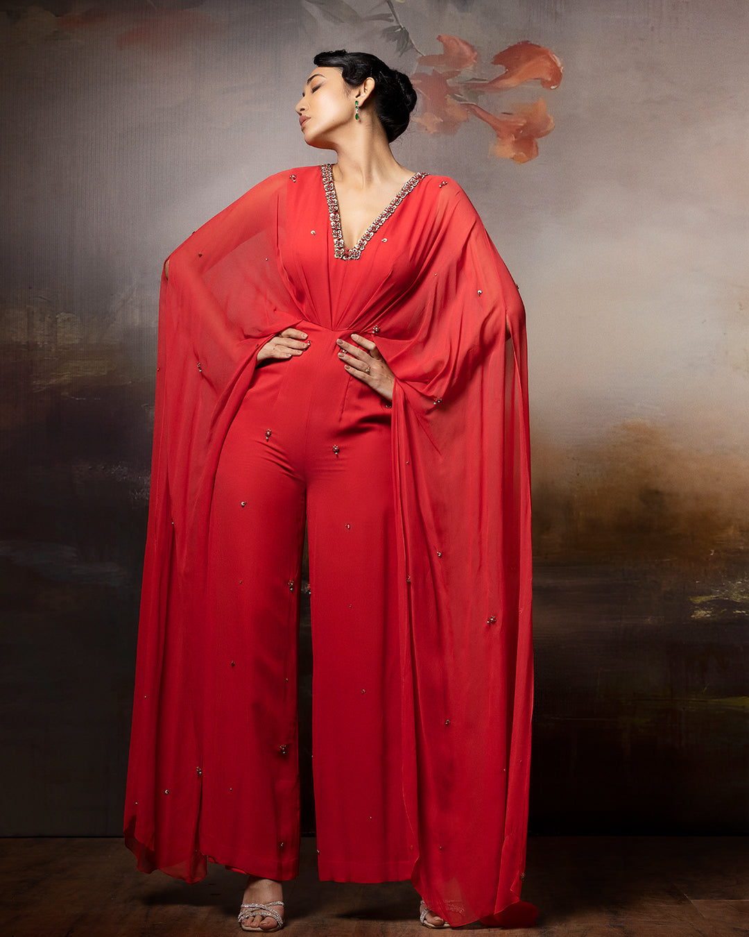 Featuring a coral cowl jumpsuit in gorgette