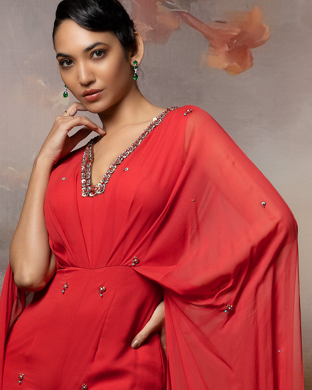 Featuring a coral cowl jumpsuit in gorgette
