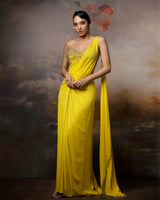 Featuring a citrin corset saree gown in gorgette, crepe and net with embroidery on the corset and danglings at the pallu.