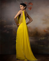 Featuring a citrin corset saree gown in gorgette, crepe and net with embroidery on the corset and danglings at the pallu.