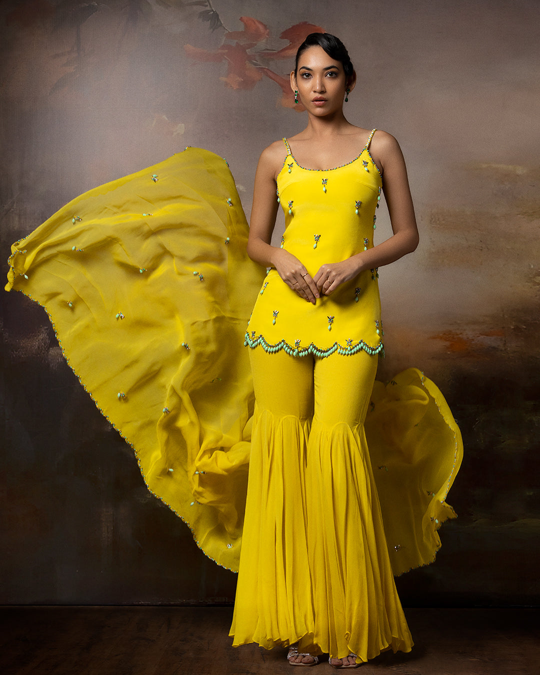 Featuring an embroidered sharara set in crape gorgette and organza