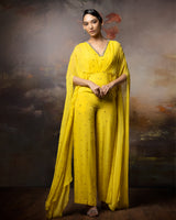 Featuring an embroidered citrine cowl jumpsuit in gorgette