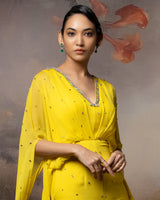 Featuring an embroidered citrine cowl jumpsuit in gorgette
