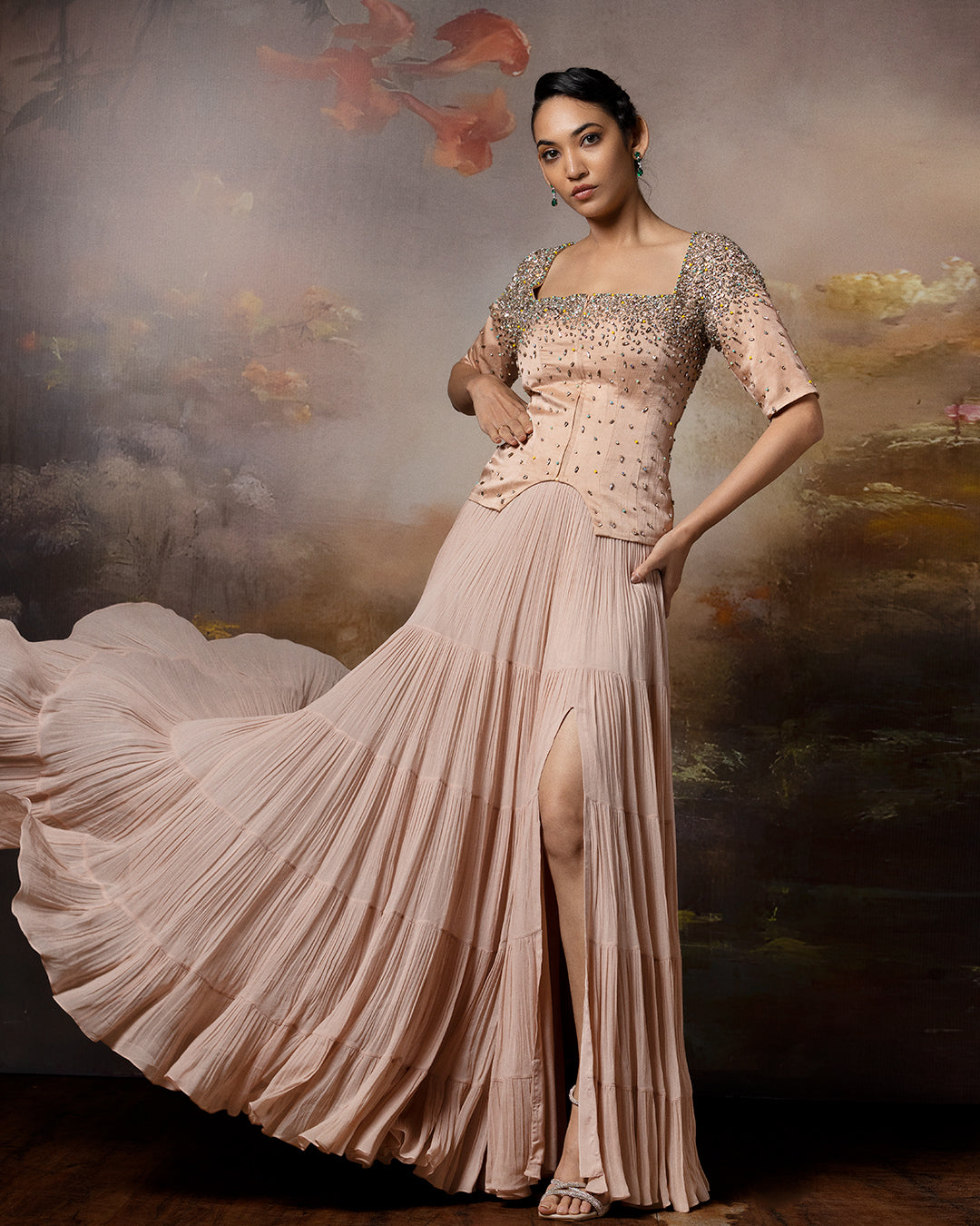 Featuring a beige top with flowy lehenga in linen stain and gorgette with embroidery on the corset and danglings at the pallu.