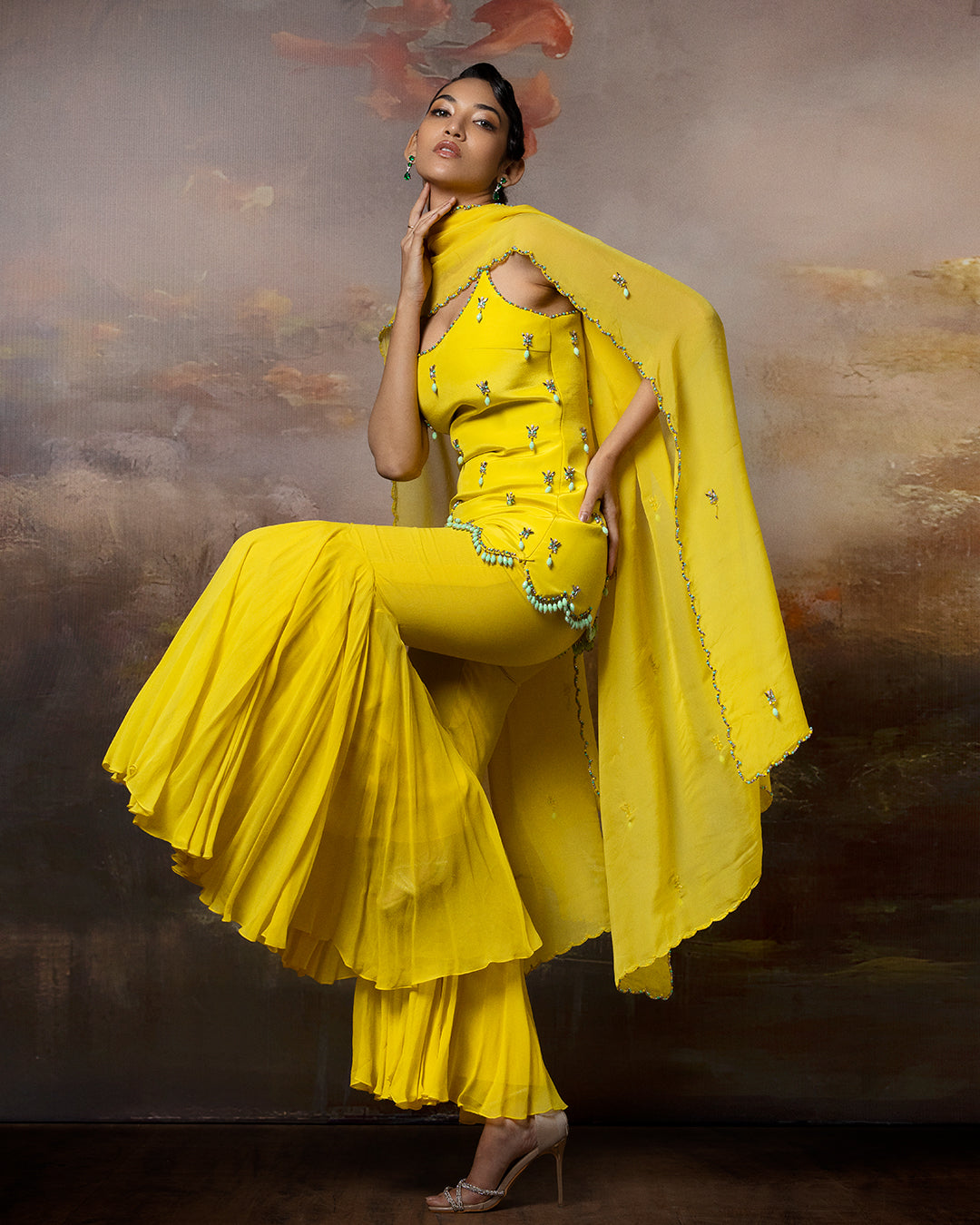 Featuring an embroidered sharara set in crape gorgette and organza