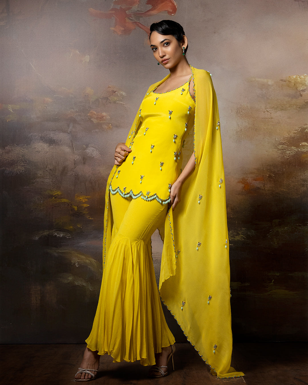 Featuring an embroidered sharara set in crape gorgette and organza